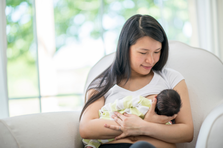 Woman breastfeeding her baby after receiving help from a lactation consultant