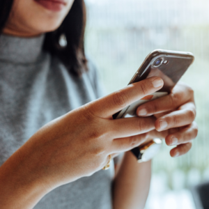 Woman using Bluetooth to sync her Tempdrop device