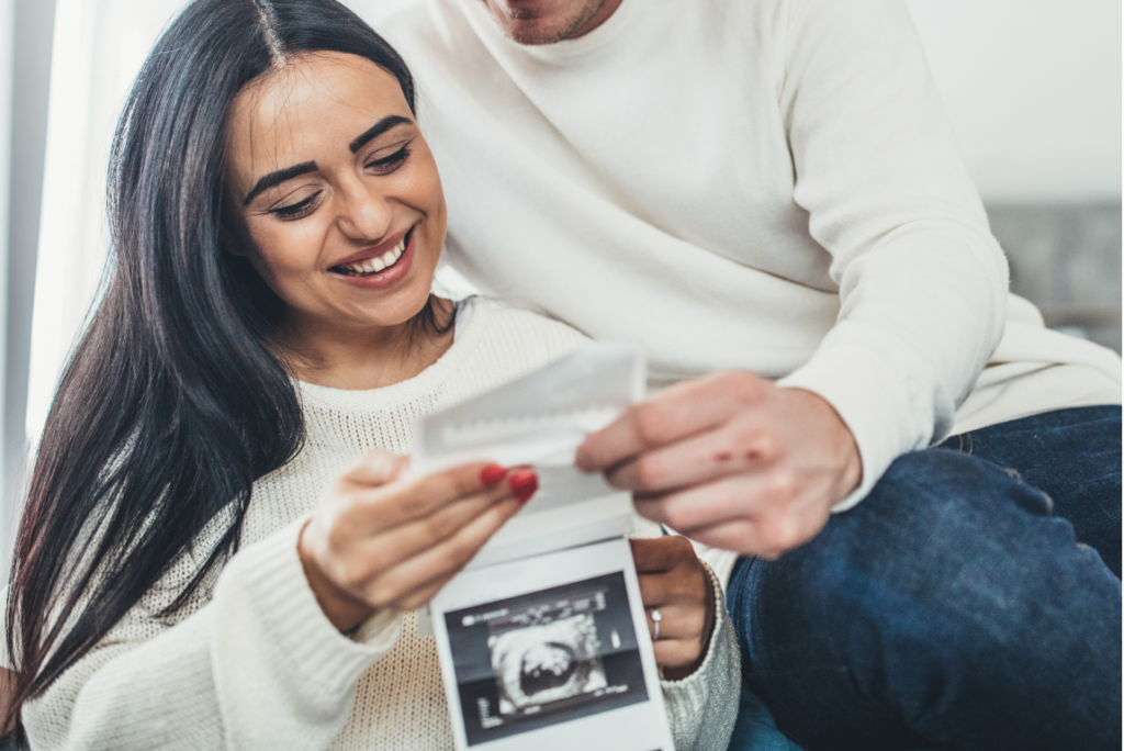 Woman and man looking at ultrasound